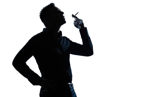 one caucasian man portrait smoking cigarette silhouette in studio  isolated on white background