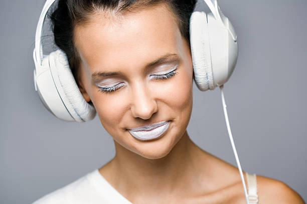 istock White noise, brunette with headphones. 148467747