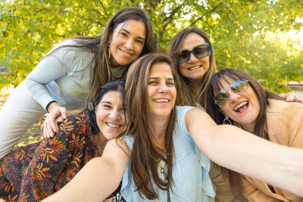 istock Five cheerful friends in summer clothes taking a selfie. 1484685223