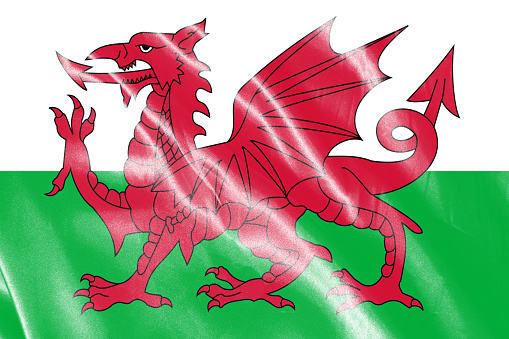 Flag of wales waving with highly detailed textile texture pattern