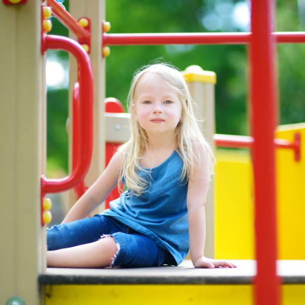 istock Cute little girl having fun on a playground 1484699406
