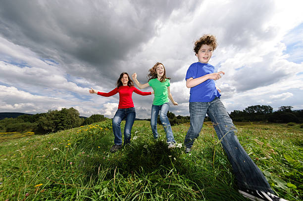 istock Active family running, jumping outdoor 148469959