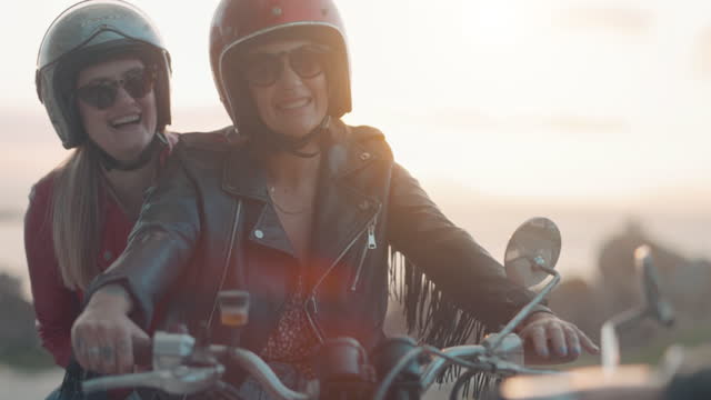 Women outdoors with motorbike