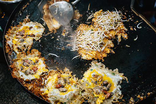 Crispy pan fried mussels with eggs at Thai night market