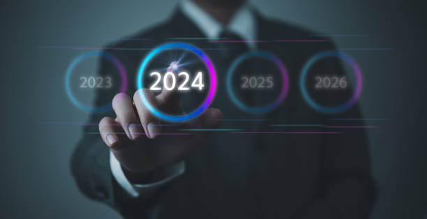 istock Hand Touching New Goals and Plans on Virtual Screen 2024 and numbers for Next Year Technology Concept 1484708965