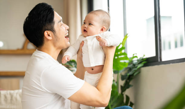 istock image of asian father and son at home 1484711622