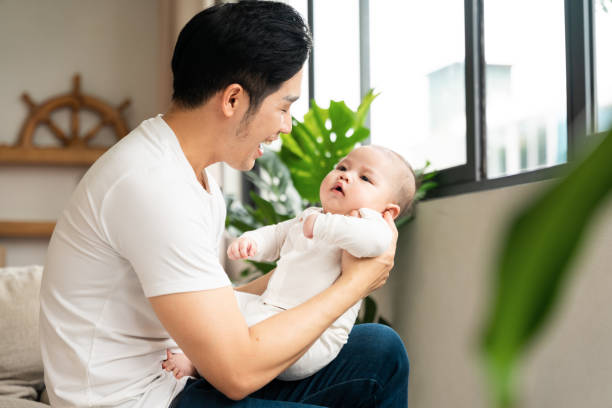 istock image of asian father and son at home 1484711625