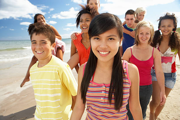 istock Teenagers walking on beach 148471423