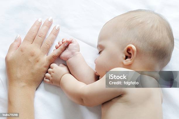Baby Sleeping Close To Her Mother Stock Photo - Download Image Now - 6-11 Months, Affectionate, Baby - Human Age