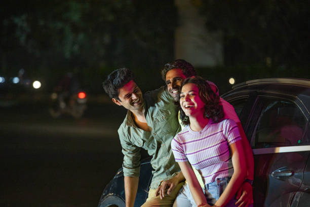 istock Friends having fun on the street at night 1484720314