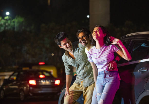 istock Friends having fun on the street at night 1484720329