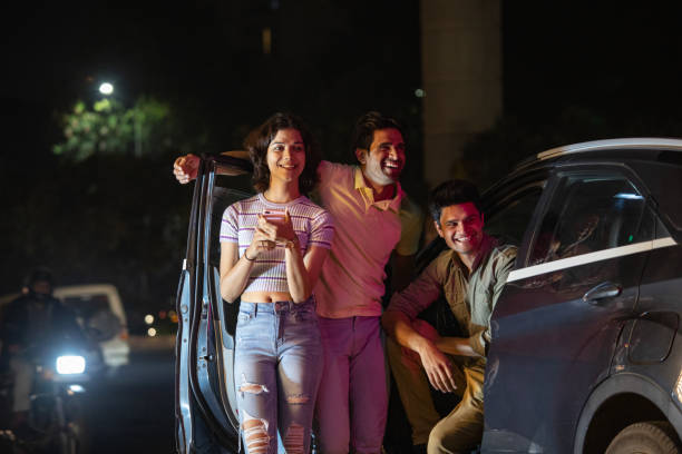 istock Friends having fun on the street at night 1484720340