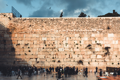 Western Wall - Wailing Wall or short 'the Kotel' in Jerusalem. Crowd of Jews praying at the Western Wall - Wailing Wall - Klagemauer during the Passover Celebration Days. Wailing Wall - Western Wall, Jerusalem Old City, Israel, Middle East.