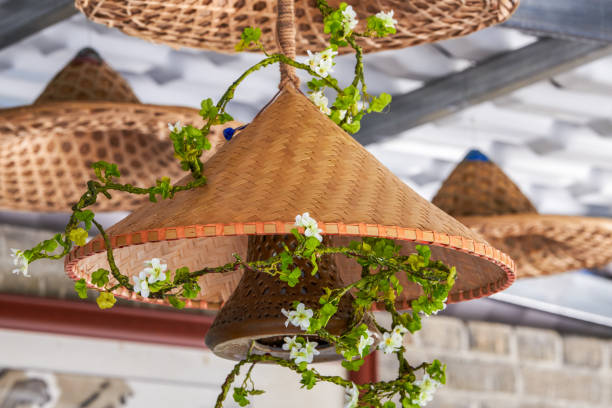 istock Rural house ceiling covered with straw hat decoration 1484723830