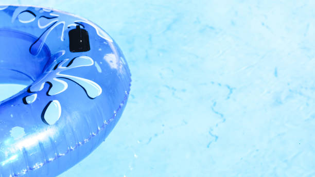 istock Blue inflatable mattress floating in swimming pool water. 1484727476