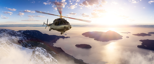 Helicopter flying over Canadian Mountain Landscape on West Coast. Adventure Travel Concept. 3d Rendering Heli. Aerial View near Squamish and Vancouver, BC, Canada.
