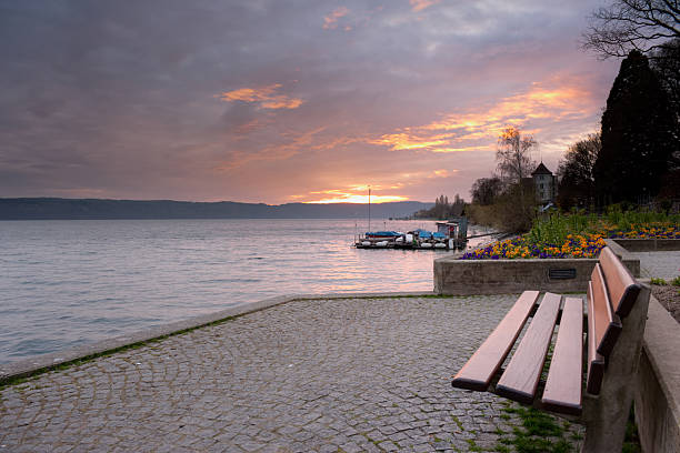 istock Sunset at lake of constance - with bench 148473366