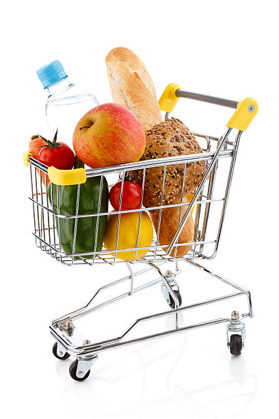 istock Shopping trolley with products on white 148473400