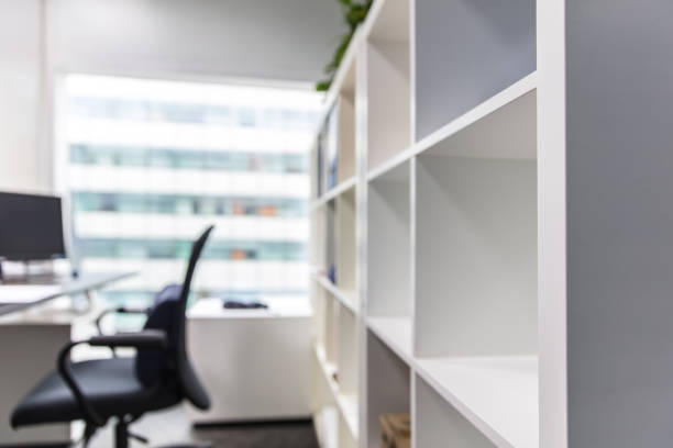 istock Empty modern office interior with shelves and chairs 1484735097
