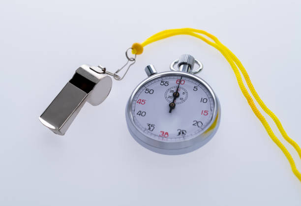 Stopwatch with whistle on white background