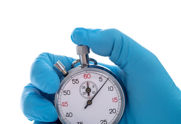 istock Doctor hand holding a stopwatch 1484737460