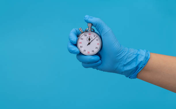 istock Doctor hand holding a stopwatch 1484737468