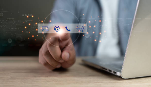 istock Customer support hotline people connect. Businessman using a laptop and touching on virtual screen contact icons 1484739292