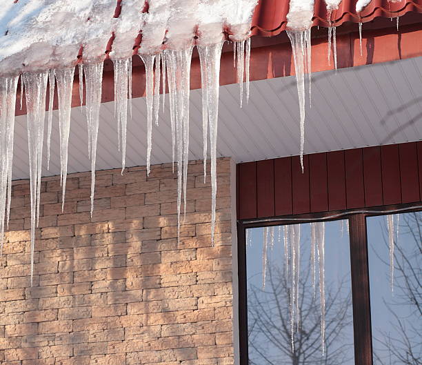 istock icicles on building roof at winter day 148473995