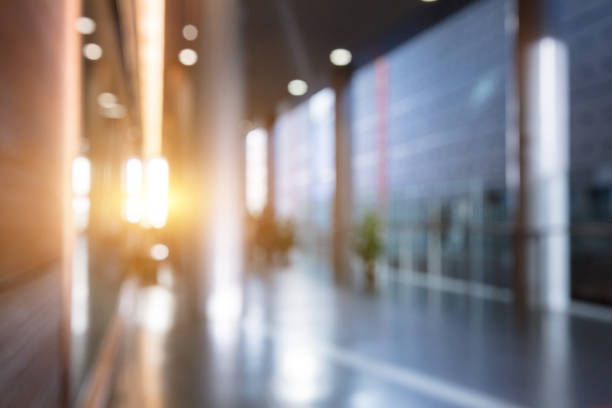 istock Lobby with people walking around, blurred background 1484740306