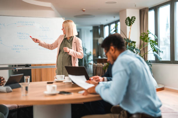 istock Motivated Multiracial Team Discusses Business Strategy 1484741026