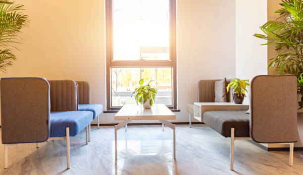 istock Waiting area at the reception of a modern company, spacious and bright with comfortable sofas 1484742057