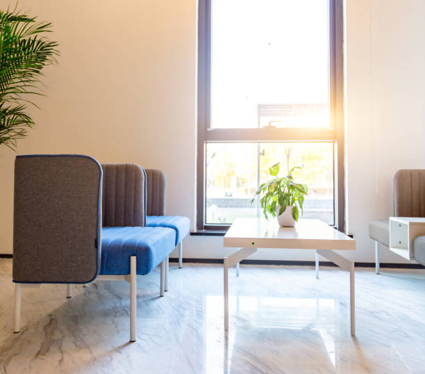 istock Waiting area at the reception of a modern company, spacious and bright with comfortable sofas 1484742095