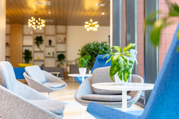 istock Building interior reception area with round table and chairs 1484742319
