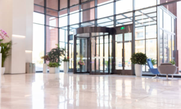 istock Building interior hall with revolving glass doors 1484743116