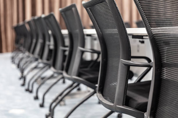 istock Empty meeting room in modern company interior with neat tables and chairs 1484744521