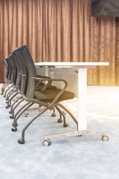 istock Empty meeting room in modern company interior with neat tables and chairs 1484744754