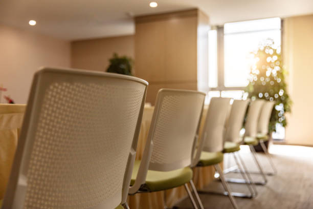 istock Modern company conference room interior with neat tables and chairs 1484745554