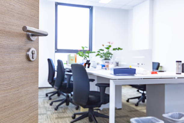 istock Open wooden door of modern office 1484745959
