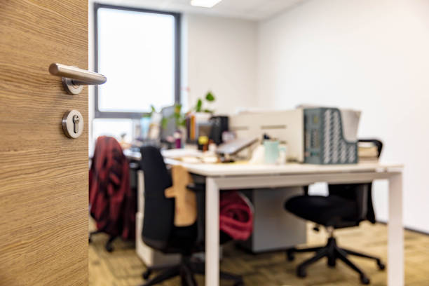 istock Open wooden door of modern office 1484746165