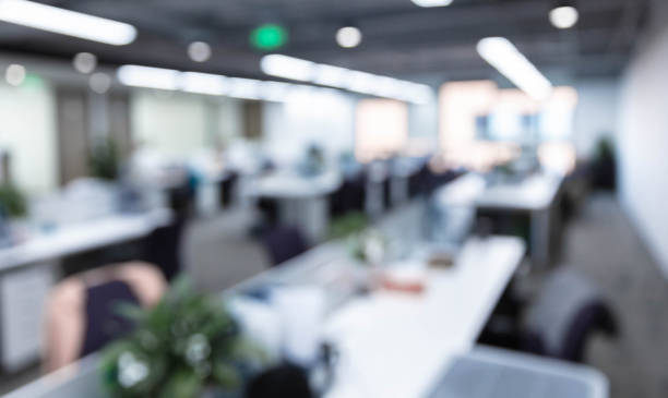 istock Blurred background of modern office interior with green plants 1484746360