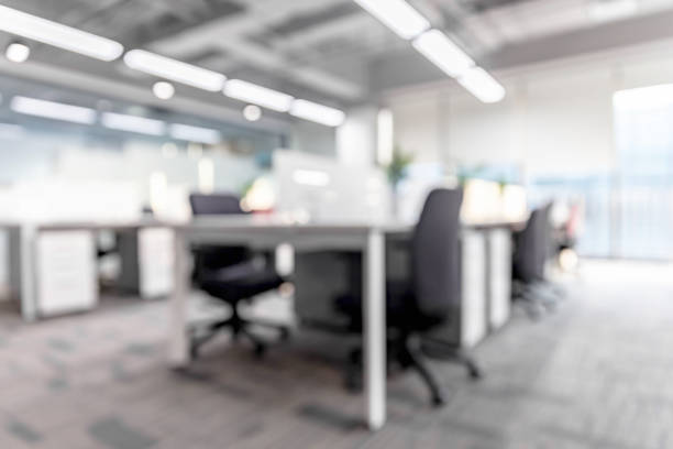 istock Blurred background of modern office interior with green plants 1484746468