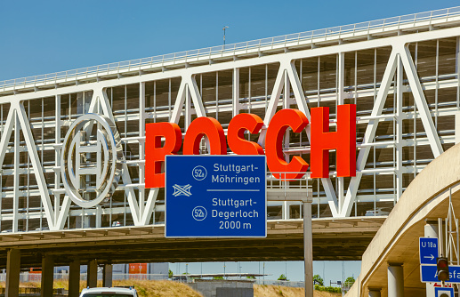 Stuttgart, Germany- August 15 2022: Bosch car parking, Messe Stuttgart, Traffic Autobahn A8 highway.