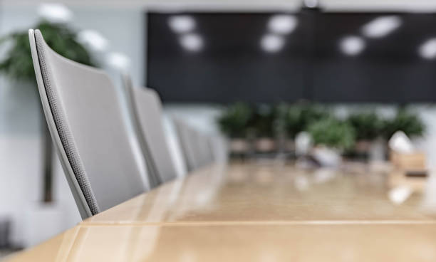 istock Modern office interior, empty conference room with green plants and tables and chairs 1484747205