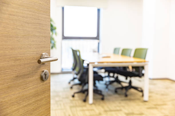 istock Open wooden door of modern office 1484747902
