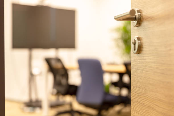 istock Open wooden door of modern office 1484748019
