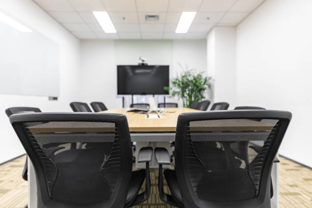 istock Modern office interior, empty conference room with green plants and tables and chairs 1484748123