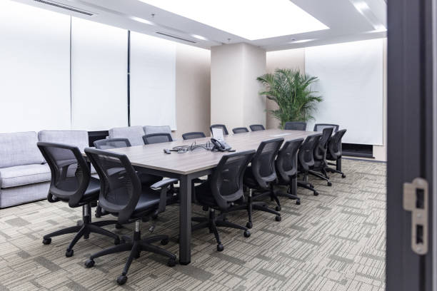 istock Modern office interior, empty conference room with green plants and tables and chairs 1484748619