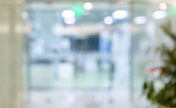 istock Blurred background of corridor in modern office interior 1484749287