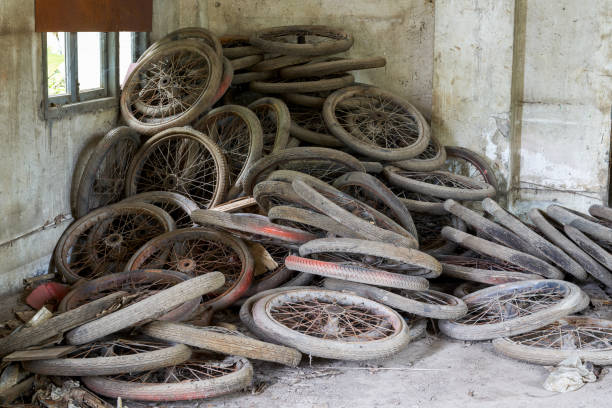 Used tire and other trash in a forest.