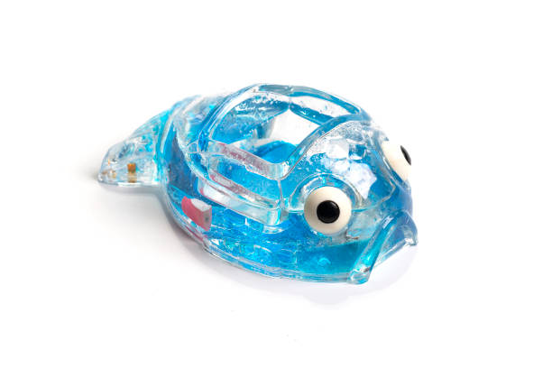 istock Toy plastic tropical fish isolated on white background. 1484753059